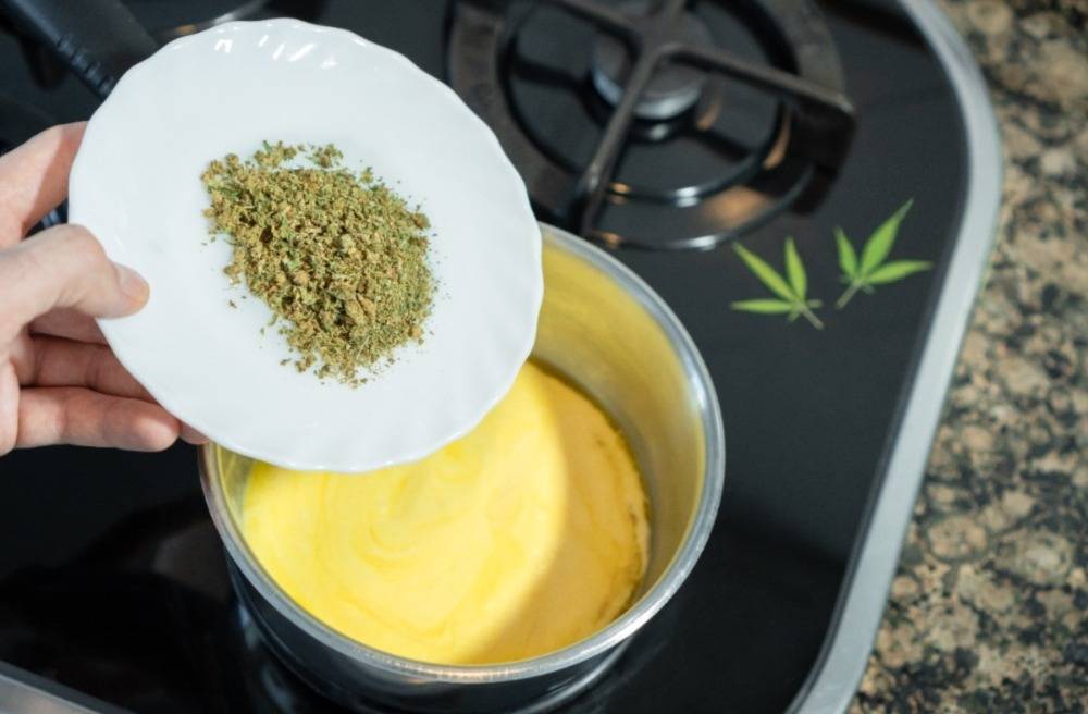 Mixing crushed cannabis with melted butter to prepare cannabutter. Speed Greens