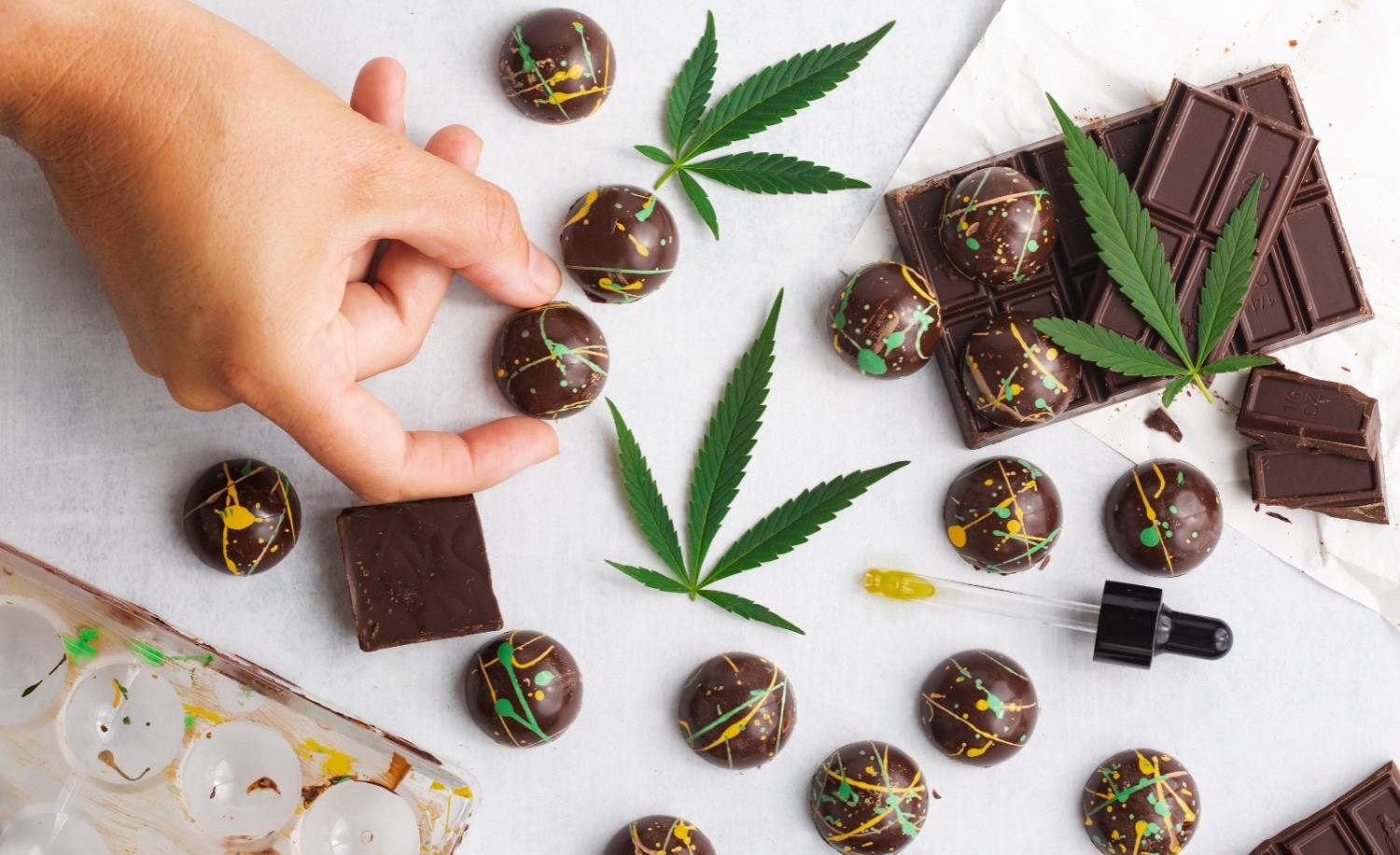 Cannabis edibles with chocolate and cocoa butter designs. Speed Greens 