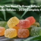 Colorful cannabis edibles including THC gummies, chocolate, and candy arranged on table - beginner's guide to trying cannabis edibles